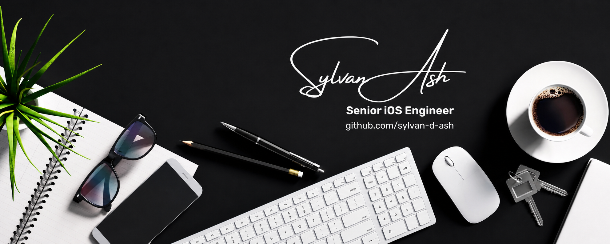 A dark desk with a notebook, plant, glasses, keyboard and coffee, introducing Sylvan Ash, Senior iOS Engineer.